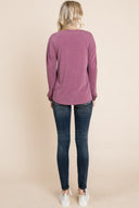 Solid black long sleeve top made of Spandex, stylish and fitted, from Dress4less.com, shown on a model with a close-up view.